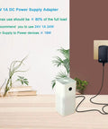 Budget Friendly 24V DC 1A Power Supply Adapter For LED Strips And CCTV Cameras plugged into wall outlet with connected device