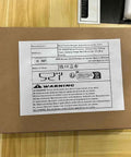 Built Damn Tough Coiled Extension Cord package showing warning and manufacturer details on a brown box.
