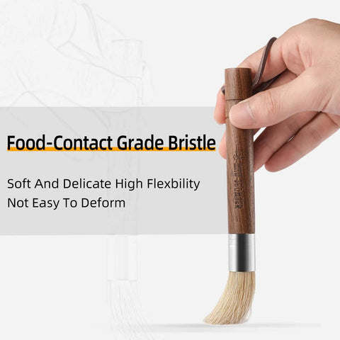 Hand holding Air Blower And Cleaning Brush Kit For Espresso Machines And Coffee Grinders, Walnut handle, bristles visible
