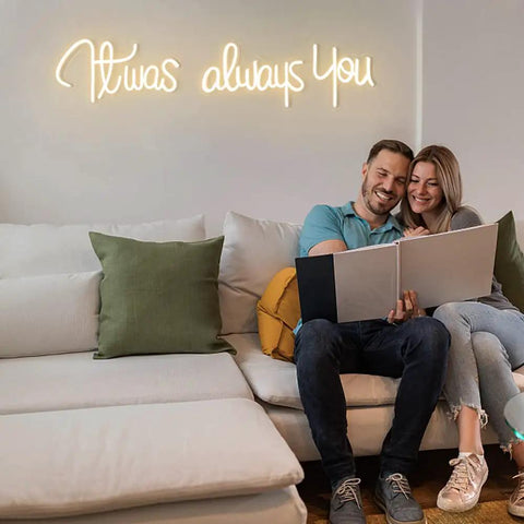 Couple on couch with 'It Was Always You Neon Sign For Weddings And Anniversaries, Engagements, Birthdays And Parties'