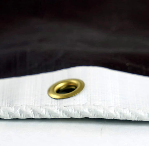 Close-up of brass grommet on HydraTarp Super Beefy Heavy Duty 16 Mil Tarp, 18 by 24 feet, white and brown reversible poly tarpaulin.