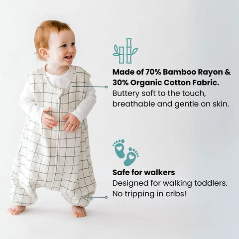 Toddler wearing Cozy Dreamsuit Toddler Sleep Sack With Feet For Safe Sleep And Easy Moves Walker Sleep Bag, checkered design.