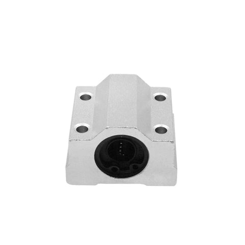 Aluminum linear bearing slide block with four mounting holes and circular bearing bore (front view)