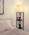 Maxwell Charger Shelf Floor Lamp With USB Ports And Electrical Outlet beside bed in bedroom, Havana Brown Finish, 9W 800-Lumen LED