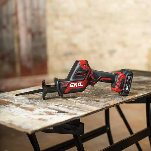 Badass Brushless 12 Volt Reciprocating Saw Kit With Quick Charge Battery on wood surface for demolition projects.