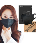 Woman wearing black Made In Korea 50 Pack Face Masks With 5 Layer Filtration, Over 94 Percent Filter Efficiency, Medium White Dust Mask