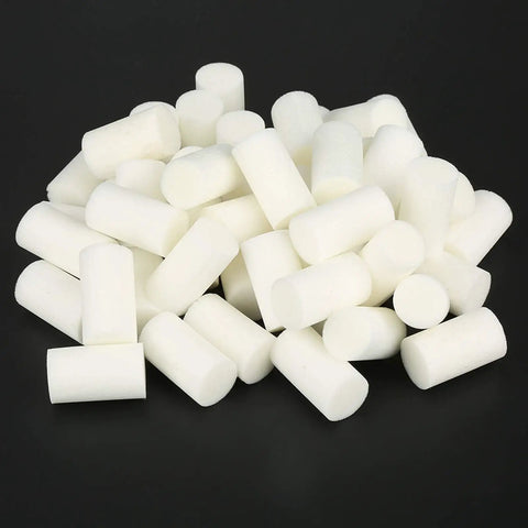 Pile of white fiber cotton filters, part of Nebulizer Filter Replacements 50 Pack for Nebulizer Accessories and Air Compressor Pumps for 30 MPa Machines.