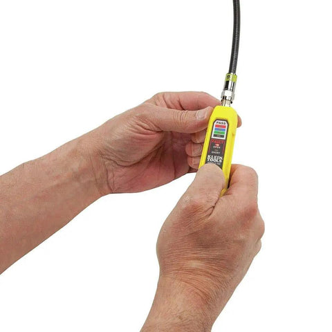 Hands using Coax Install And Test Kit With Crimp Tool, Tester, Stripper And Universal F Connectors for quick cable prep.