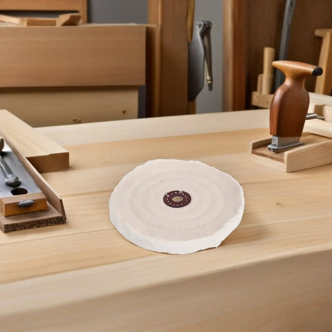 Premium 2 Inch Cotton Buffing Polishing Wheels With 12mm Hole For Jewelry And Watches on a workbench with tools.