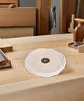 Sturdy Cotton Buffing Wheels With 12mm Arbor Hole For Bench Grinder Polish Mirror Finish On Jewelry And Wood Great Stuff For DIY Pros And Industrial Jobs on a wooden workbench.