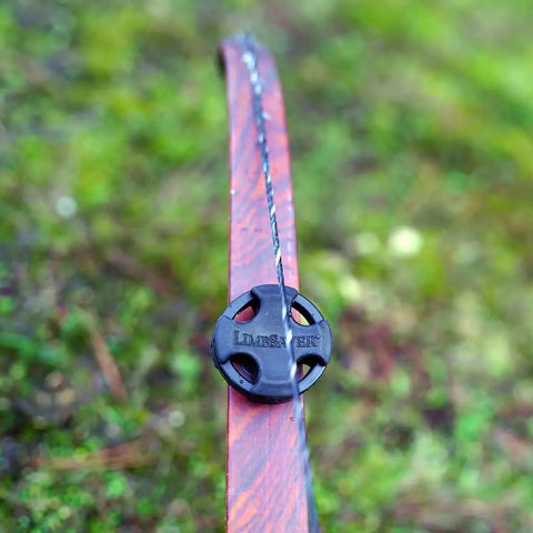 Close-up of a bow with Low-Profile Recurve Dampener Kit For Recurve And Youth Solid Limb Compound Bows, reducing vibration.