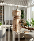 Ultra Soft Balsa Wood Foraging Bird Toy With Canyon Groove Destructible Chew Safe Untreated Natural Wood Stainless Steel Hook hanging in cage with parrot inspecting it.