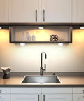 Under cabinet kitchen scene with Six Pack LED Puck Lights With Remote Color Changing RGBW Under Cabinet Lighting Battery Powered installed.