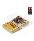 Mini Pocket Scale 100g 0.01g Digital Gram Scale With Cover Small Travel Ounce Scale measuring coffee beans on display, batteries shown
