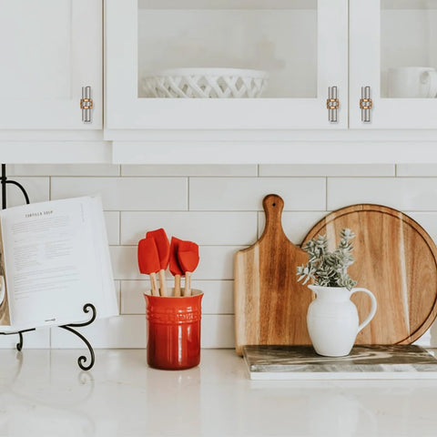 Kitchen cabinets with 10 Pack Brushed Satin Nickel And Champagne Bronze Cabinet Knobs Set, shown installed in a modern kitchen setup.