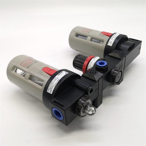 Three Unit Air Source Treatment FRL Combo For Pneumatic Systems with two beige cylinders and black connectors