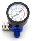 Pro Air Pressure Regulator With Gauge For Spray Paint And Pneumatic Tools showing a pressure gauge dial with blue fittings.