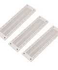 Pack of three SYB-120 700-Point Solderless Breadboard 60x12 for Prototyping Arduino Projects, Shield Compatible, white surface.