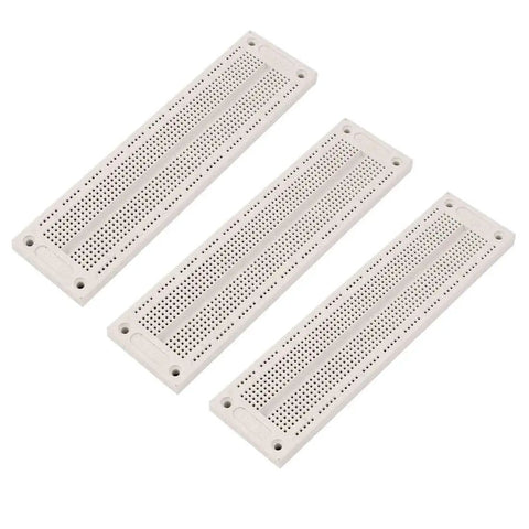 Pack of three SYB-120 700-Point Solderless Breadboard 60x12 for Prototyping Arduino Projects, Shield Compatible, white surface.