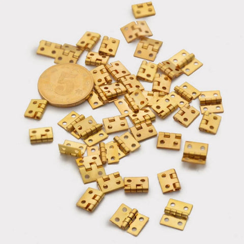 Small Copper Box Hinges 8x10mm Set Of 30 For DIY Wooden Jewelry Boxes And Cabinets Durable Rust Resistant Hardware scattered on white surface.