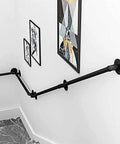 Badass Industrial Wrought Iron Stair Railing Kit Twenty Foot Wall Mount Banister Pipe Rail for stairway transition with artwork.