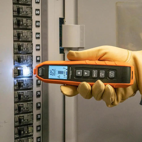 Advanced Underground Circuit Breaker Finder and Wire Tracer Kit in use, held by a gloved hand, checking a breaker panel.