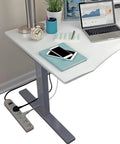 Workhorse Universal Power Strip With Six Outlets And Six Foot Cord 220 240V Surge Protector under a desk setup with laptop and lamp