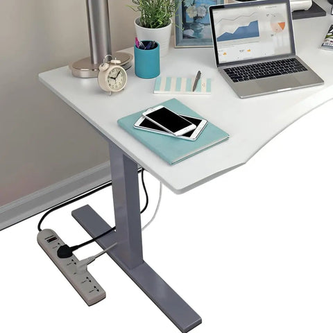 Workhorse Universal Power Strip With Six Outlets And Six Foot Cord 220 240V Surge Protector under a desk setup with laptop and lamp