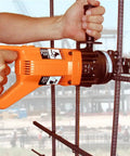 Heavy Duty Portable Electric Rebar Cutter With D Handle Grip For Cutting Up To 5/8 Inch #5 Steel Bars in use, cutting rebar.