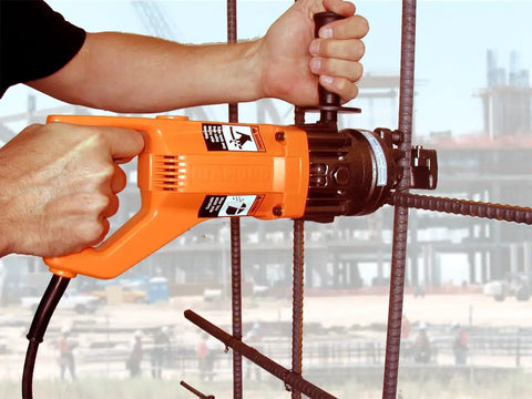 Heavy Duty Portable Electric Rebar Cutter With D Handle Grip For Cutting Up To 5/8 Inch #5 Steel Bars in use, cutting rebar.