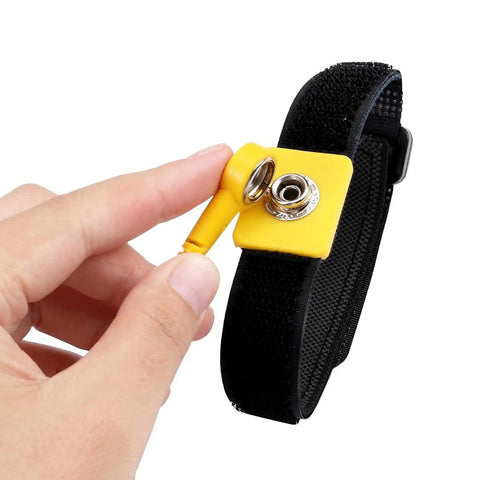 Person holding Anti Static Wrist Strap 11 Inch Adjustable ESD Wristband With Grounding Clip For Electronics And PC Building