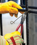 D201-7CSTA Linesman Pliers with spring-loaded action cutting rebar tie wire, shown with kickass grip and aggressive knurl.