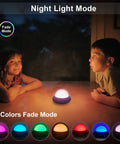 Children enjoying Mini DJ Disco Ball Light 2 In 1 With Sound Activated Multicolor LEDs in night mode on a table.