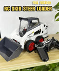 One Fourteenth Scale RC Skid Steer Loader With Eleven Channel Full Function Remote displayed on a wooden surface