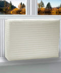 Legit Indoor Window Ac Cover That Keeps Your Setup Sharp And Shields Five To Seven Thousand Btu Units Fitting 21 By 15 By 3.5 Inches From Brisk Weather And Dust Builds Using Soft Washable Polyester In Crisp White, shown on a window ledge.