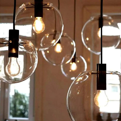 Cluster of Industrial Chic Glass Globe Pendant Light For Kitchen Loft Dope Vibe E27 Base Modern Hanging Lamp with lit bulbs.