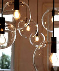Industrial Clear Glass Globe Pendant Light E27, Loft Kitchen Ceiling Fixture with glowing bulbs and adjustable cords