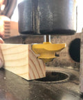 Heavy Duty Pro Grade Carbide Lock Miter Router Bit 45 Degree Cut 3/4 Inch Cutting Height 1/4 Inch Shank in action on wood