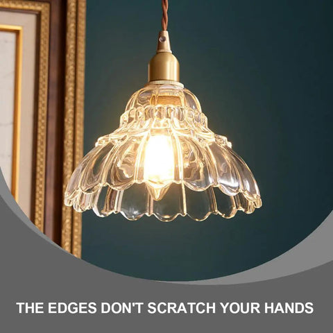 Clear Striped Glass Pendant Light Antique Brass Adjustable Mini Chandelier for Kitchen Island with smooth edges and a warm glow.