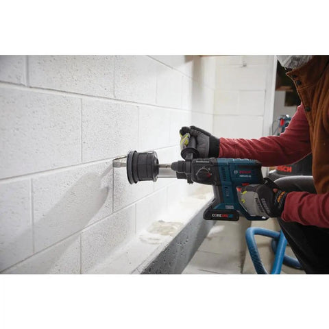 Person using Lightweight 18V Brushless SDS Plus Bulldog Rotary Hammer Bare Tool With Three Quarter Inch Chuck on brick wall