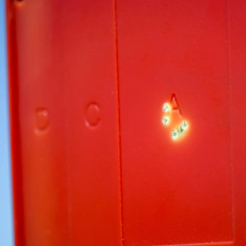 Close-up of full size self healing silhouette reactive shooting target for range training, showing impact marks on durable polymer.