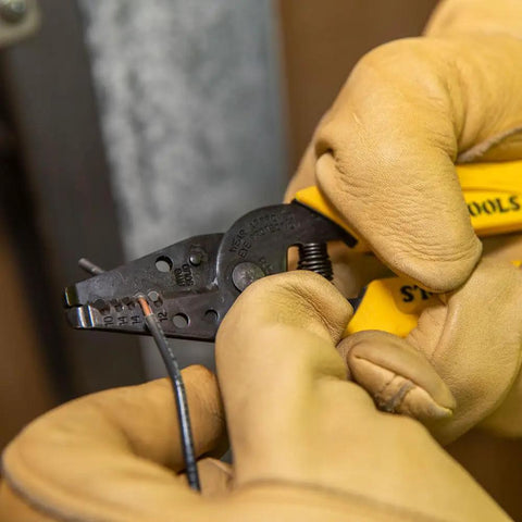 Built Tough Dual Wire Stripper Cutter For Solid Wire With 14 And 12 AWG Holes Plus 10 AWG Stripping Hole in use