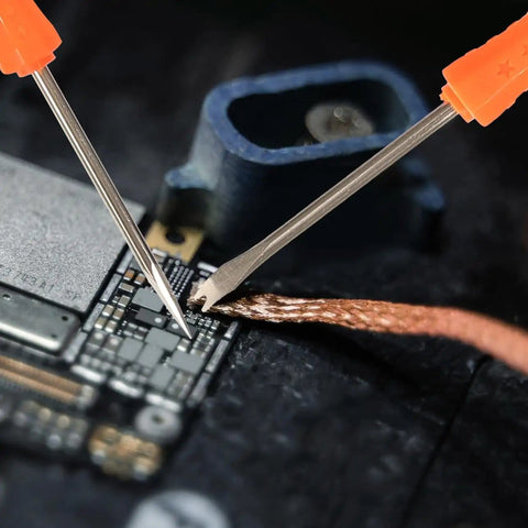 Close-up of Six Piece Soldering Assist Set Desoldering Pump And Wick Kit for PCBs One Handed Solder Aid Tools in use