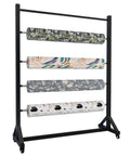 Heavy Duty Rolling Fabric Display Rack With Adjustable Cloth Roll Poles And Casters holding vinyl wallpaper on four poles.