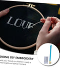 Person using Beginner Friendly Embroidery Hook Needle Set With Non Slip Metal Handle Punch Needle Kit on fabric hoop