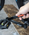 Person using 4 Piece Bike Cone Wrench Set For Precise Wheel Hub Adjustments 13mm 14mm 15mm 16mm Carbon Steel Spanner Kit