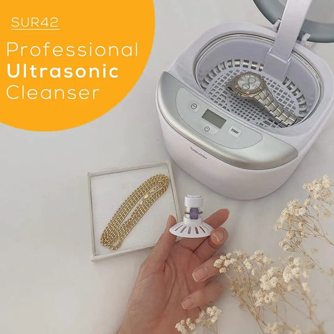 Professional Ultrasonic Cleaner With Digital Timer For Jewelry Rings Coins Eyeglasses Watches White 18.5 Fl Oz Fast Deep Clean For Everyday Grime And Tough Residue with a watch and jewelry displayed nearby.