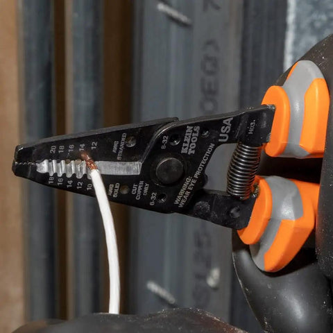 Insulated Kurve Wire Stripper Cutter 11055RINS 1000V Rated Tool in use, stripping wire; thick grips for shock protection