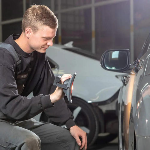 Person using MultiMatch R 1200 Lumen LED Work Light for painting jobs, providing bright light for car detailing.