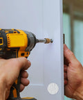 Wood Grain Adhesive Screw Hole Cover Sticker Set, 648 Pieces, 12 Colors, being installed on a white cabinet